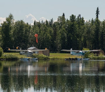 Small water airplanes lining up at an Air Base