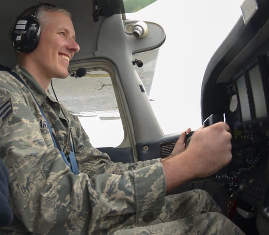 Airmen in cockpit smiling