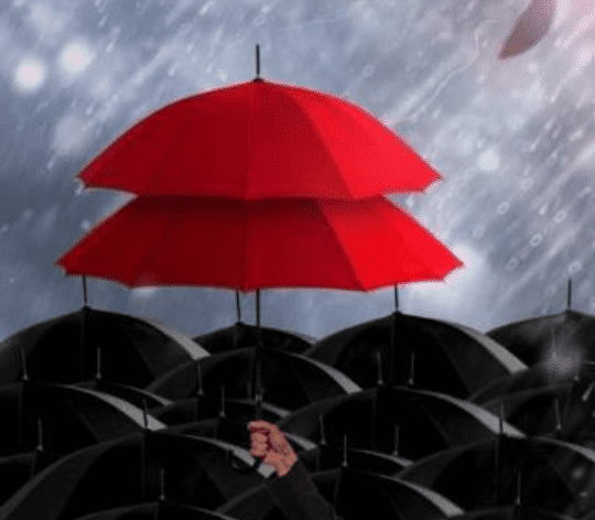 Insurance-agent-holding-umbrella-for-protection