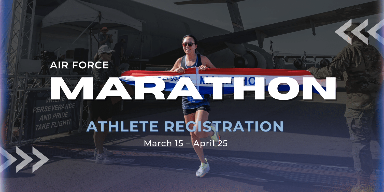 Promotional banner for the Air Force Marathon showing a female runner crossing the finish line holding a red, white, and blue ribbon labeled “Air Force Marathon.” A military aircraft and personnel are visible in the background. Text on the banner reads “Athlete Registration March 15–April 25” and “Where perseverance and pride take flight.